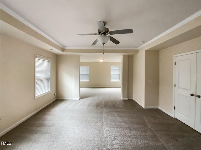 empty room with crown molding, a healthy amount of sunlight, and ceiling fan