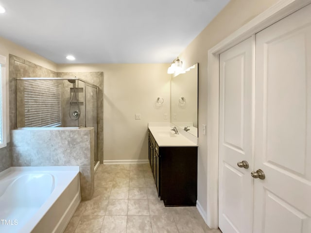 bathroom with vanity, independent shower and bath, and tile patterned flooring