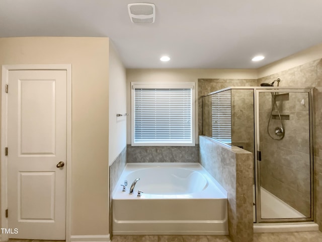 bathroom with separate shower and tub