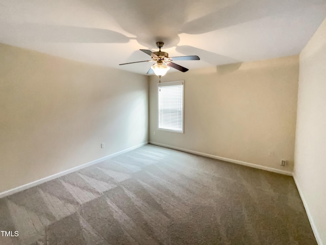 empty room with ceiling fan and carpet