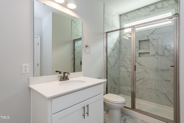 full bath with toilet, vanity, marble finish floor, and a marble finish shower