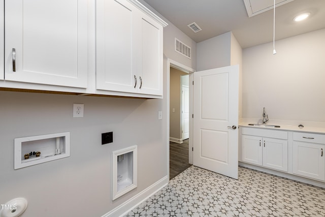 laundry area featuring washer hookup, a sink, electric dryer hookup, visible vents, and attic access