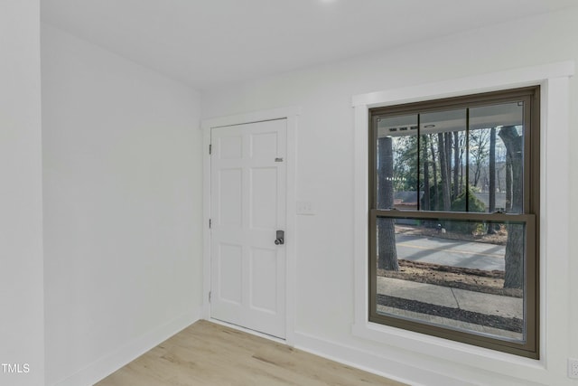 spare room featuring light wood-type flooring