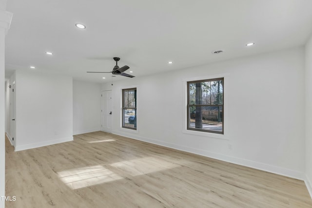 spare room featuring ceiling fan and light hardwood / wood-style floors