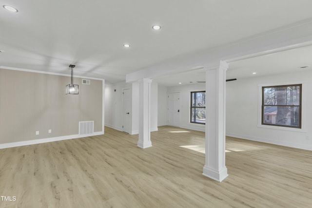 basement with light hardwood / wood-style flooring