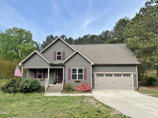 100 Churchill Rd, Louisburg, NC 27549 - view of front of property with a shingled roof, a porch, a garage, concrete driveway, and a front lawn