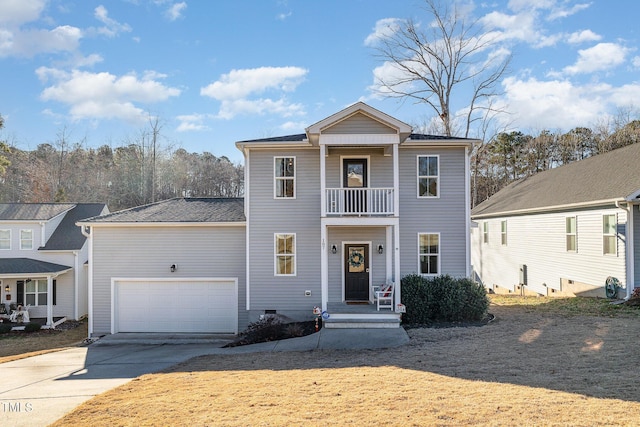 view of front of property featuring a garage and a balcony