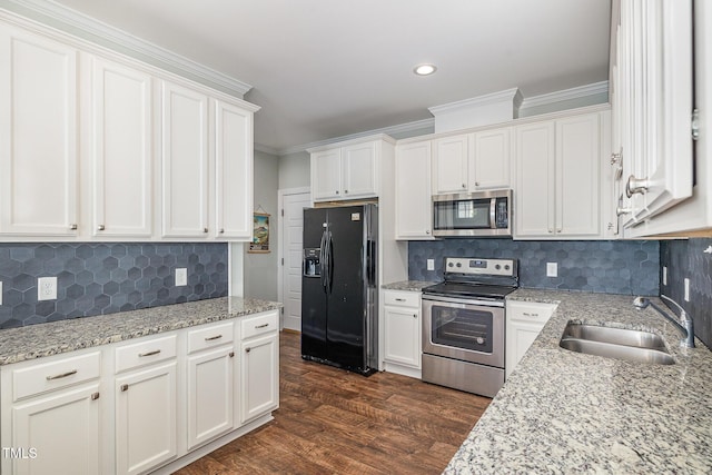 kitchen featuring sink, stainless steel appliances, and white cabinets