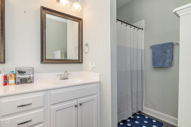 bathroom with vanity and curtained shower