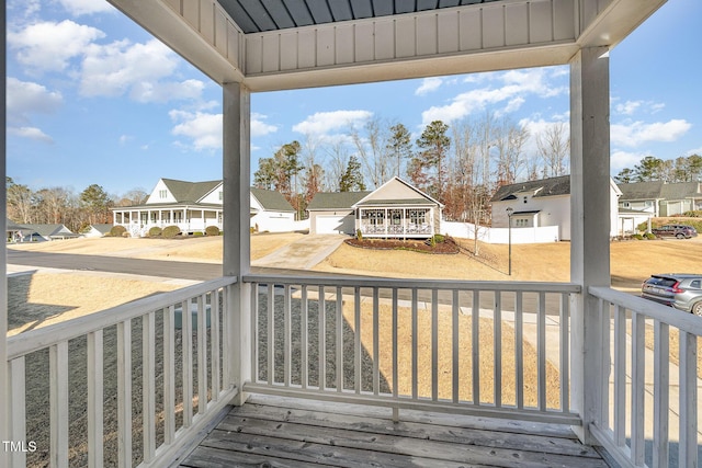 wooden terrace featuring covered porch