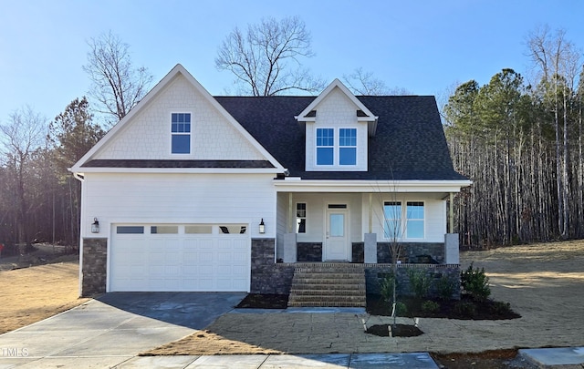 craftsman house with a garage and covered porch