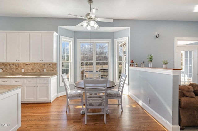 dining room featuring light hardwood / wood-style floors and ceiling fan