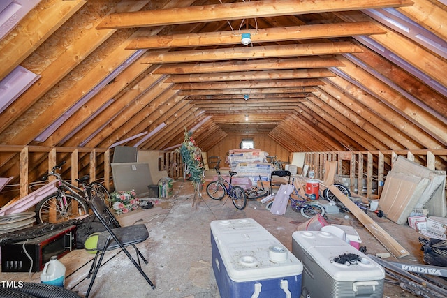 attic featuring washer / dryer