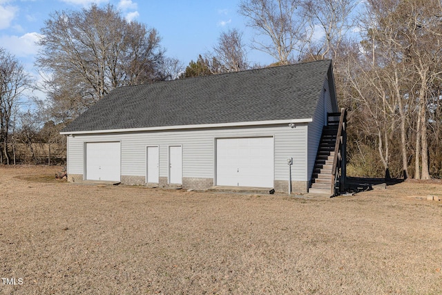 garage featuring a yard