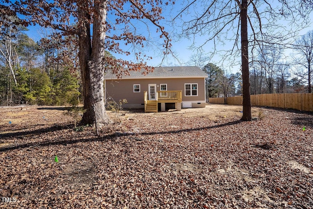 rear view of house featuring a deck