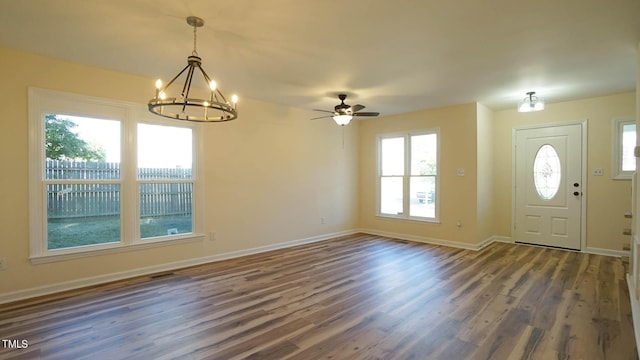 entryway featuring ceiling fan with notable chandelier and dark hardwood / wood-style floors