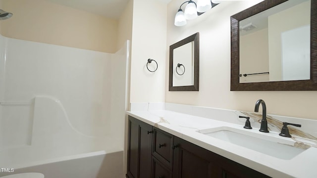 bathroom with vanity and  shower combination