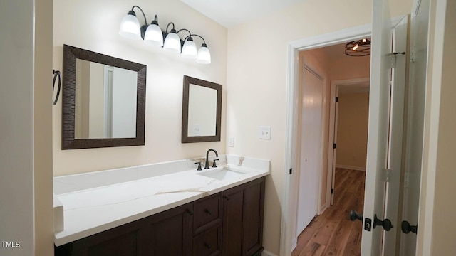 bathroom with wood-type flooring and vanity