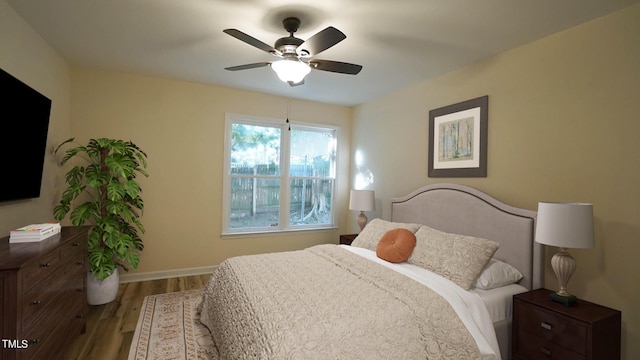 bedroom featuring hardwood / wood-style floors and ceiling fan