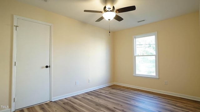 unfurnished room featuring ceiling fan and light wood-type flooring