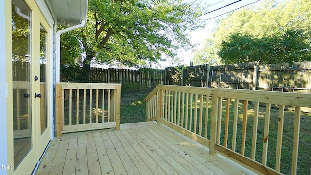 wooden terrace with a yard