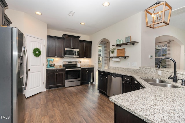 kitchen featuring appliances with stainless steel finishes, sink, pendant lighting, and plenty of natural light