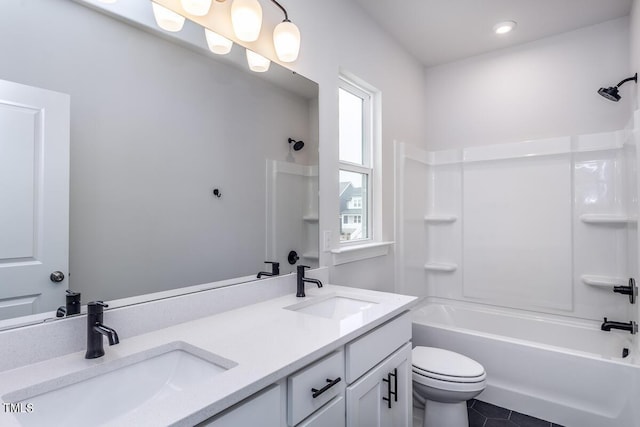 full bathroom featuring vanity, plenty of natural light, shower / bathtub combination, and toilet