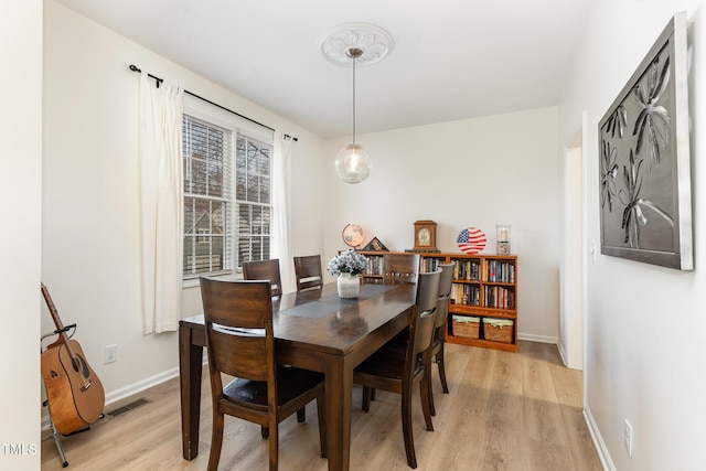 dining room featuring light hardwood / wood-style floors