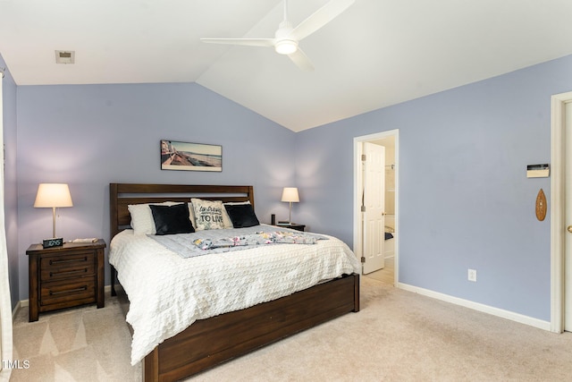 carpeted bedroom featuring lofted ceiling, connected bathroom, and ceiling fan