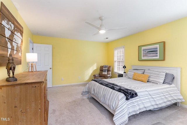 bedroom featuring ceiling fan and light carpet