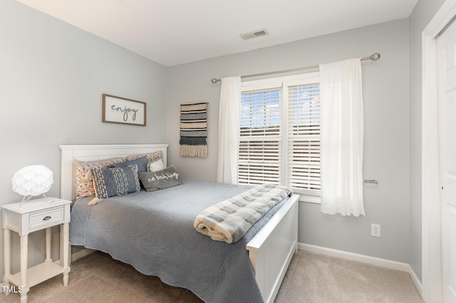 bedroom featuring light carpet