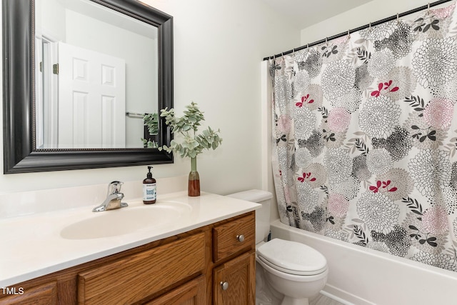 full bathroom featuring vanity, shower / bath combination with curtain, and toilet