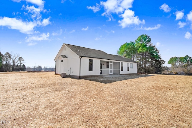 rear view of property featuring cooling unit