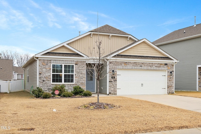 craftsman-style house with a garage and a front yard