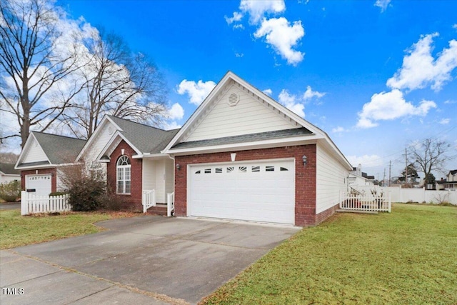 view of front of house with a garage and a front lawn