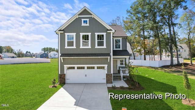 view of front of home with a garage and a front yard