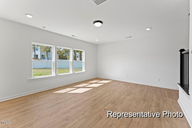 unfurnished living room featuring light wood-type flooring