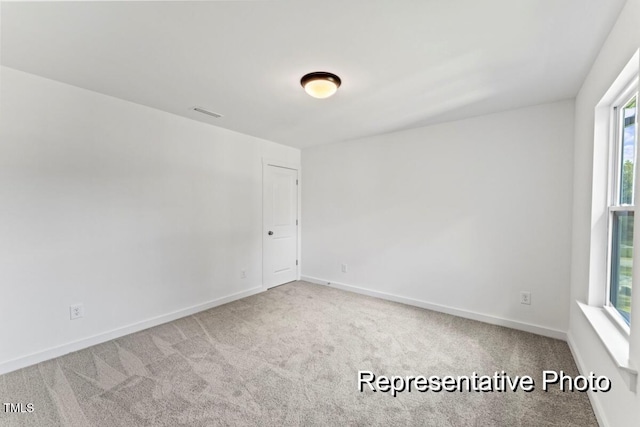 empty room featuring carpet flooring