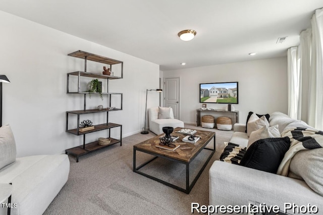 carpeted living room with recessed lighting, visible vents, and baseboards