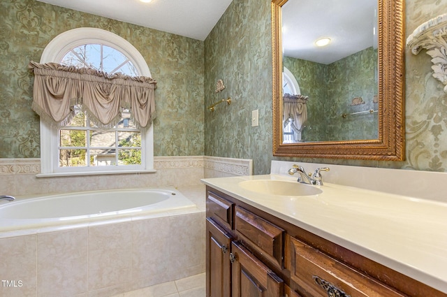 bathroom featuring plenty of natural light, a garden tub, tile patterned flooring, and wallpapered walls