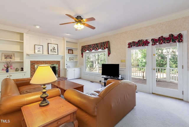 living area featuring ceiling fan, light carpet, and ornamental molding