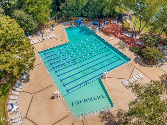 view of swimming pool with a patio