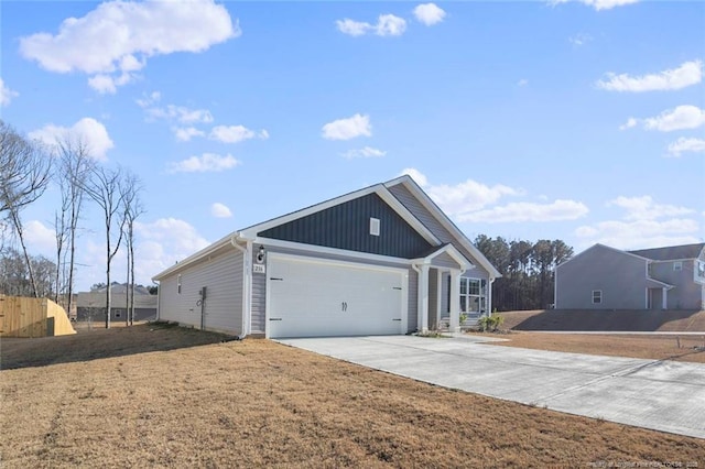 view of front facade featuring a garage and a front lawn