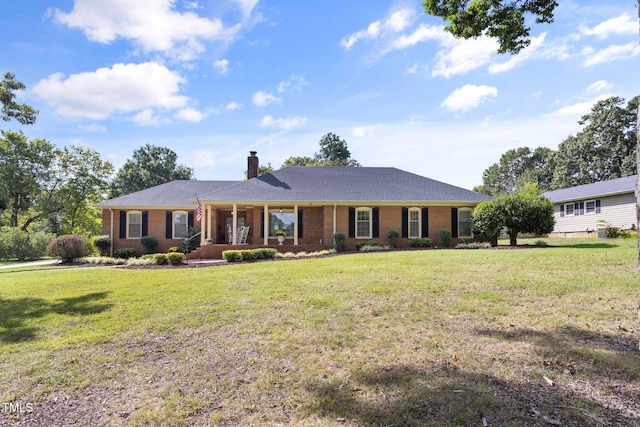 ranch-style house featuring a front yard