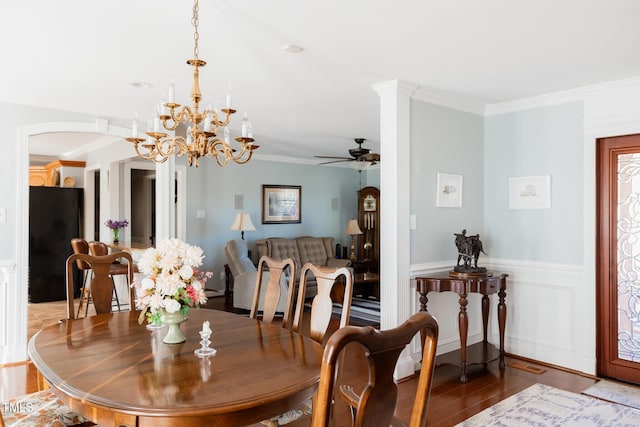 dining space featuring crown molding, ceiling fan, and wood-type flooring