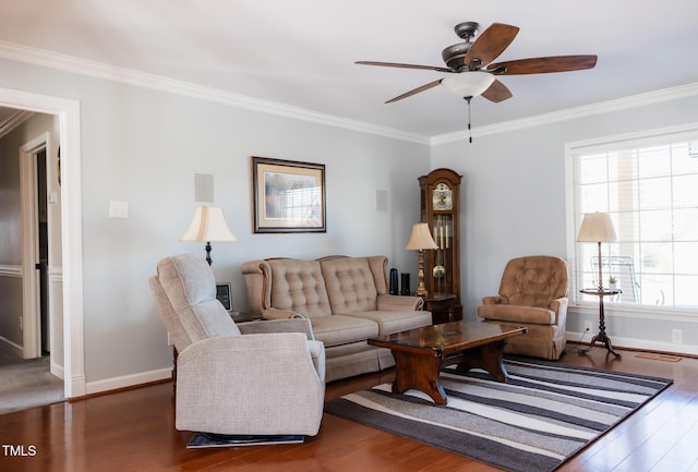 living room with ceiling fan, ornamental molding, and dark hardwood / wood-style floors