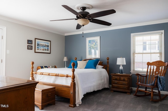 carpeted bedroom with ceiling fan and ornamental molding