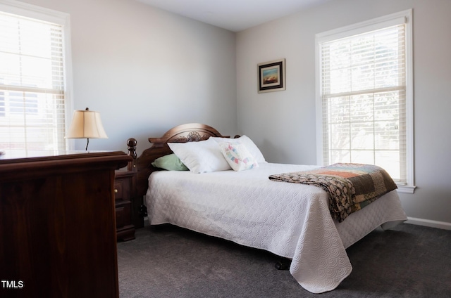 bedroom featuring dark carpet