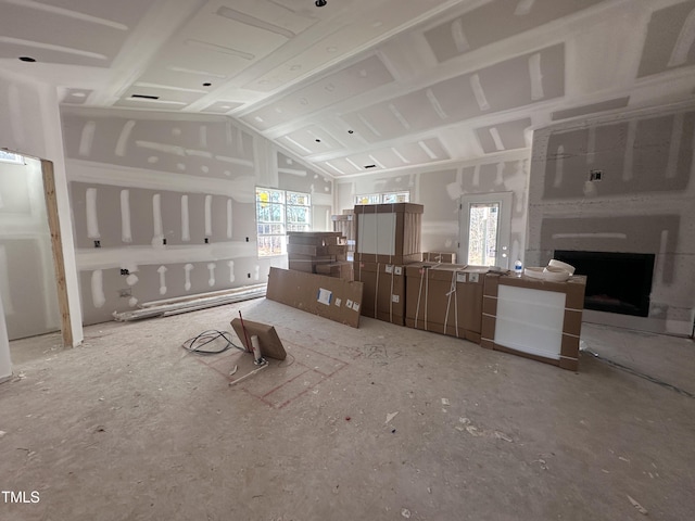 kitchen with lofted ceiling and a wealth of natural light