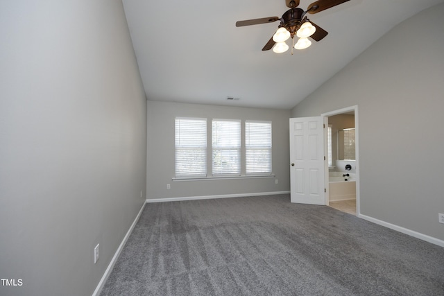 unfurnished room featuring carpet, lofted ceiling, and ceiling fan